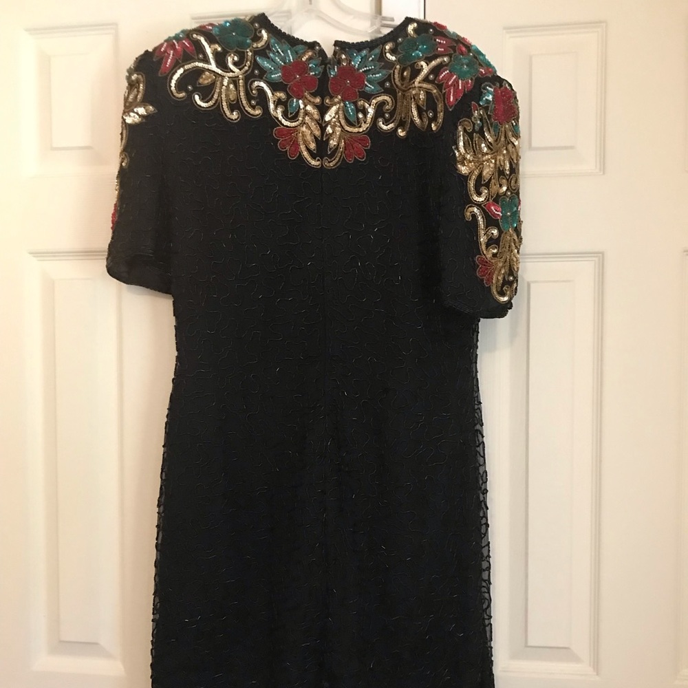 Beaded cocktail dress that comes to the knees.  It has only been worn twice.